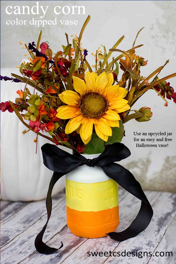 use those old mason jars for a cute candy corn vase