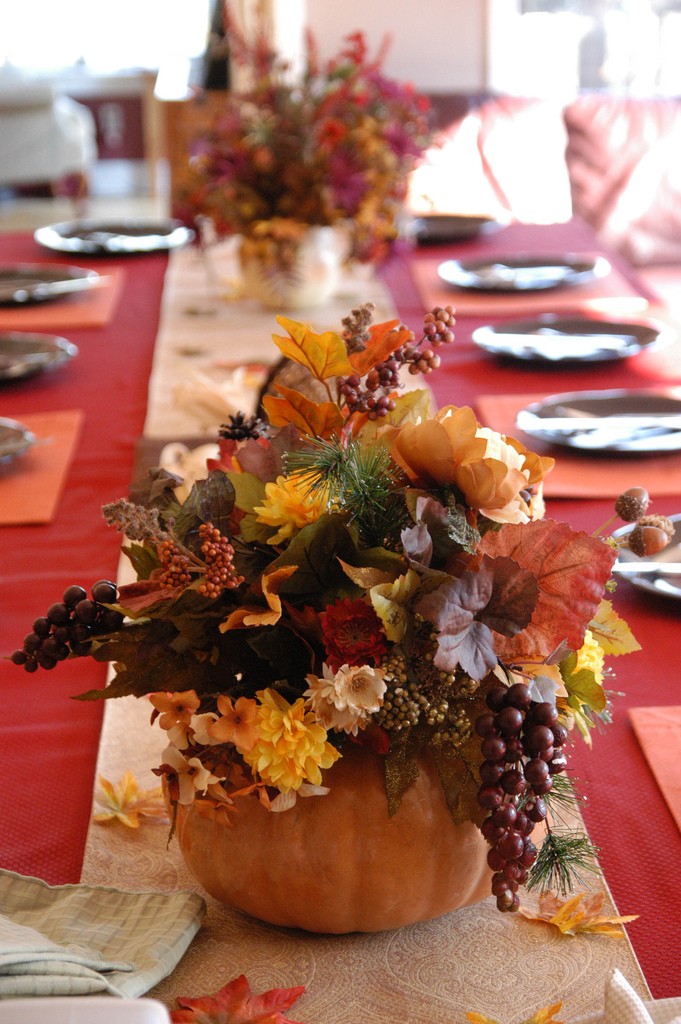 Centerpieces with flowers tucked into pumpkins