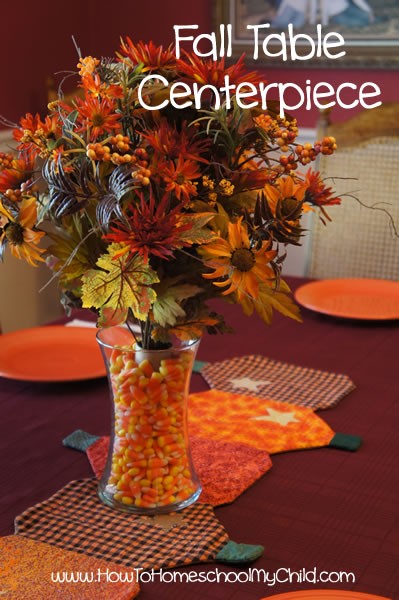 candy corn in a vase centerpiece
