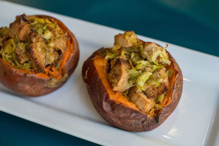 Sweet potatoes stuffed with stuffing, leeks and Brussels sprouts for a Thanksgiving side dish | MakeItGrateful.com