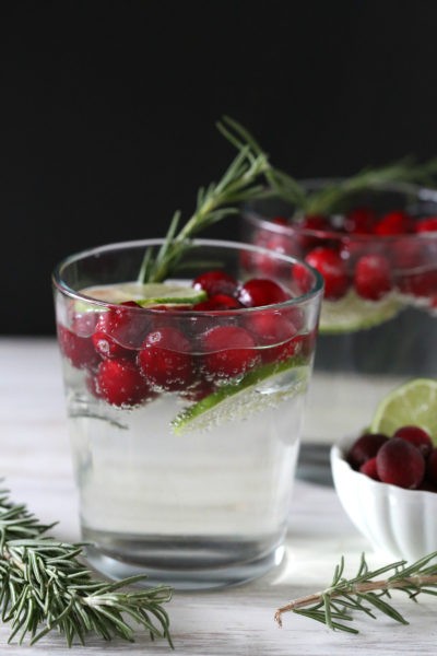 Cranberry, lime and rosemary white wine spritzer makes a gorgeous Christmas or Thanksgiving cocktail | MakeItGrateful.com