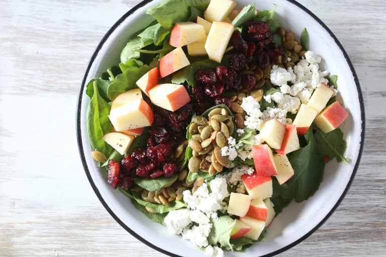 This autumn chopped kale and spinach salad has pumpkin seeds, cranberries and goat cheese -- perfect for Thanksgiving | MakeItGrateful.com