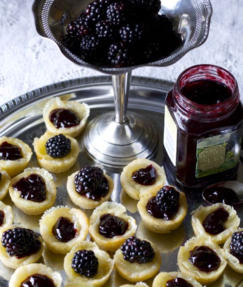Mini crusts filled with blackberries and brie.