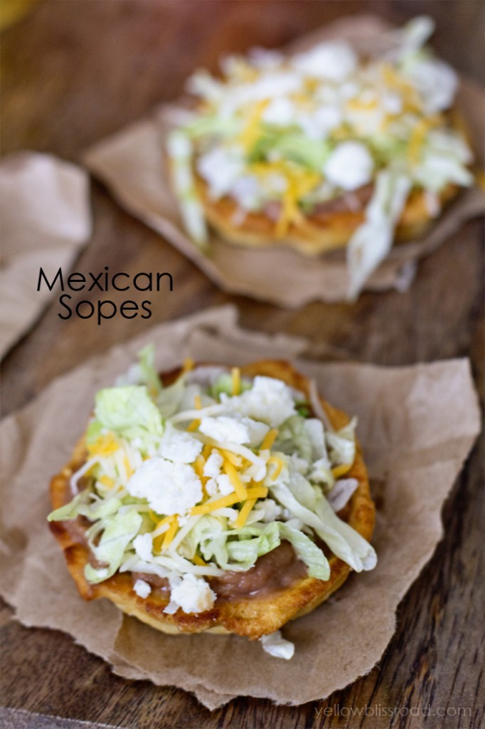 thick homemade corn tortillas topped with beans, cheese and lettuce
