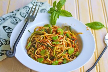 noodles made out of zucchini and topped with spicy marinara