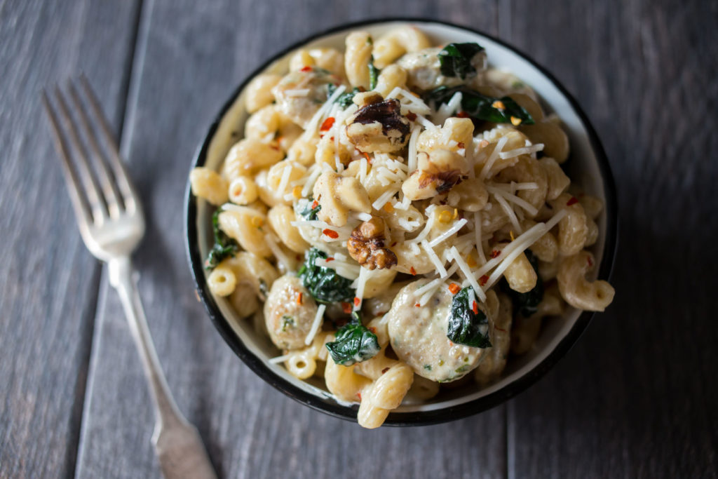 creamy pasta with sausage, spinach and walnuts