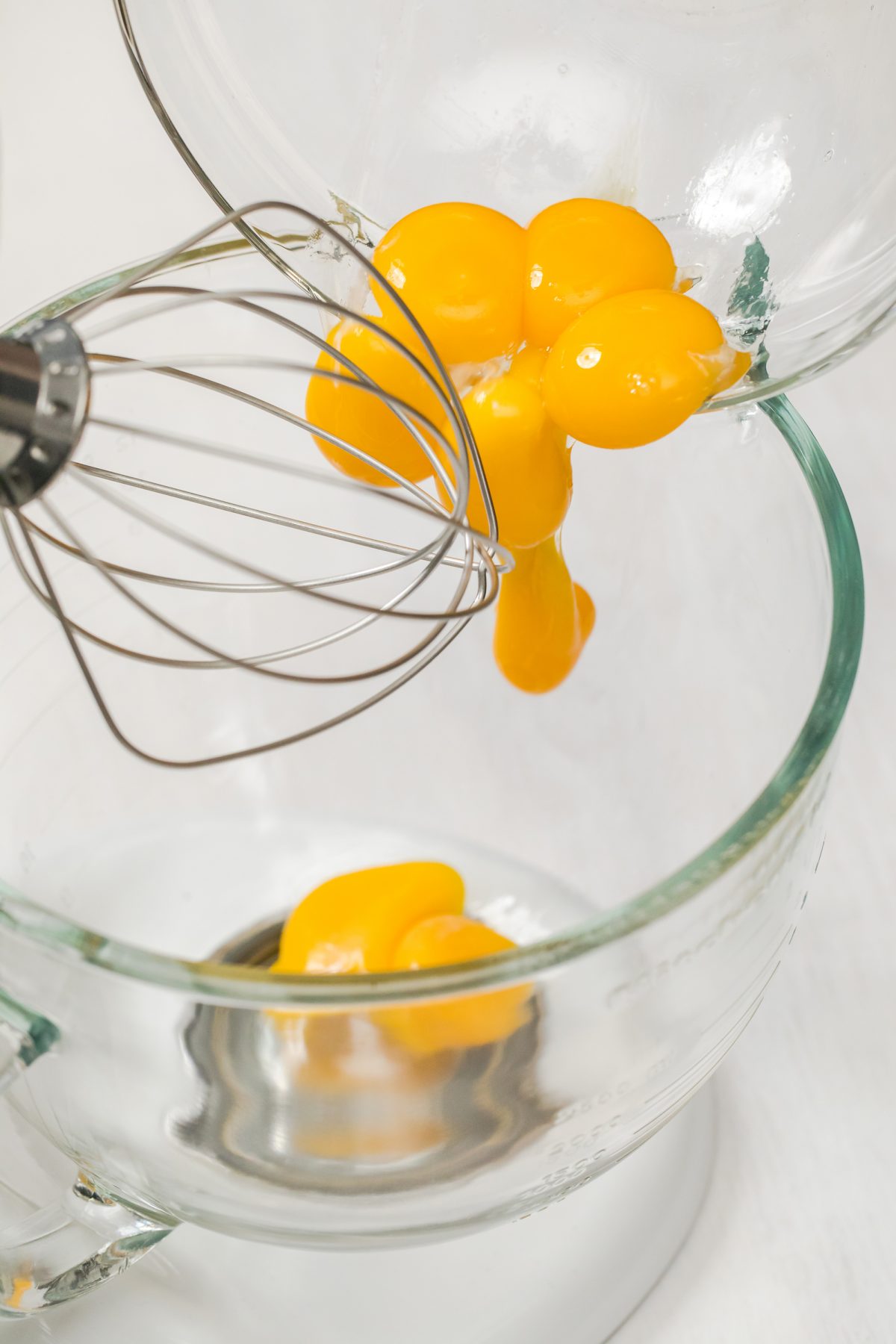 Adding egg yolks to the eggnog