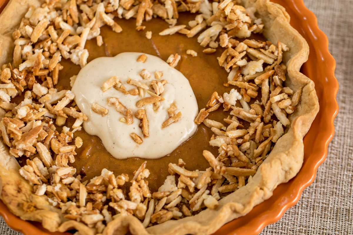 Pumpkin pie harvest with spiced cream and caramelized almonds
