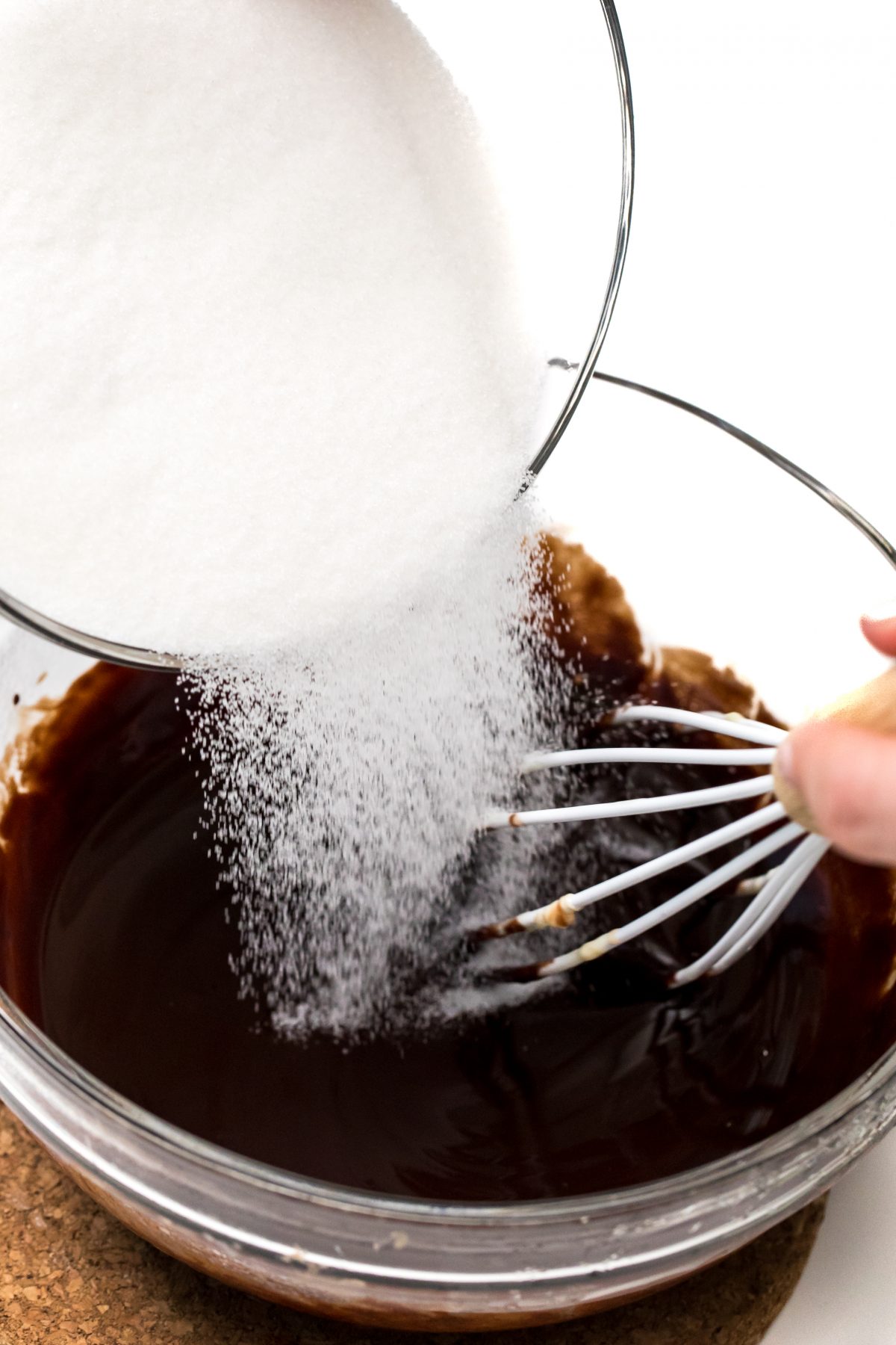 Add sugar to melted chocolate