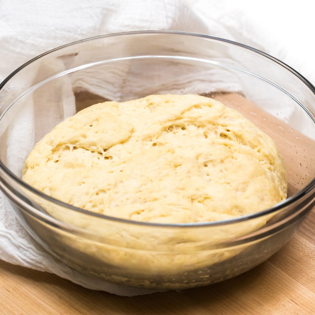 Cover dough with a towel and let sit until dough doubles in size