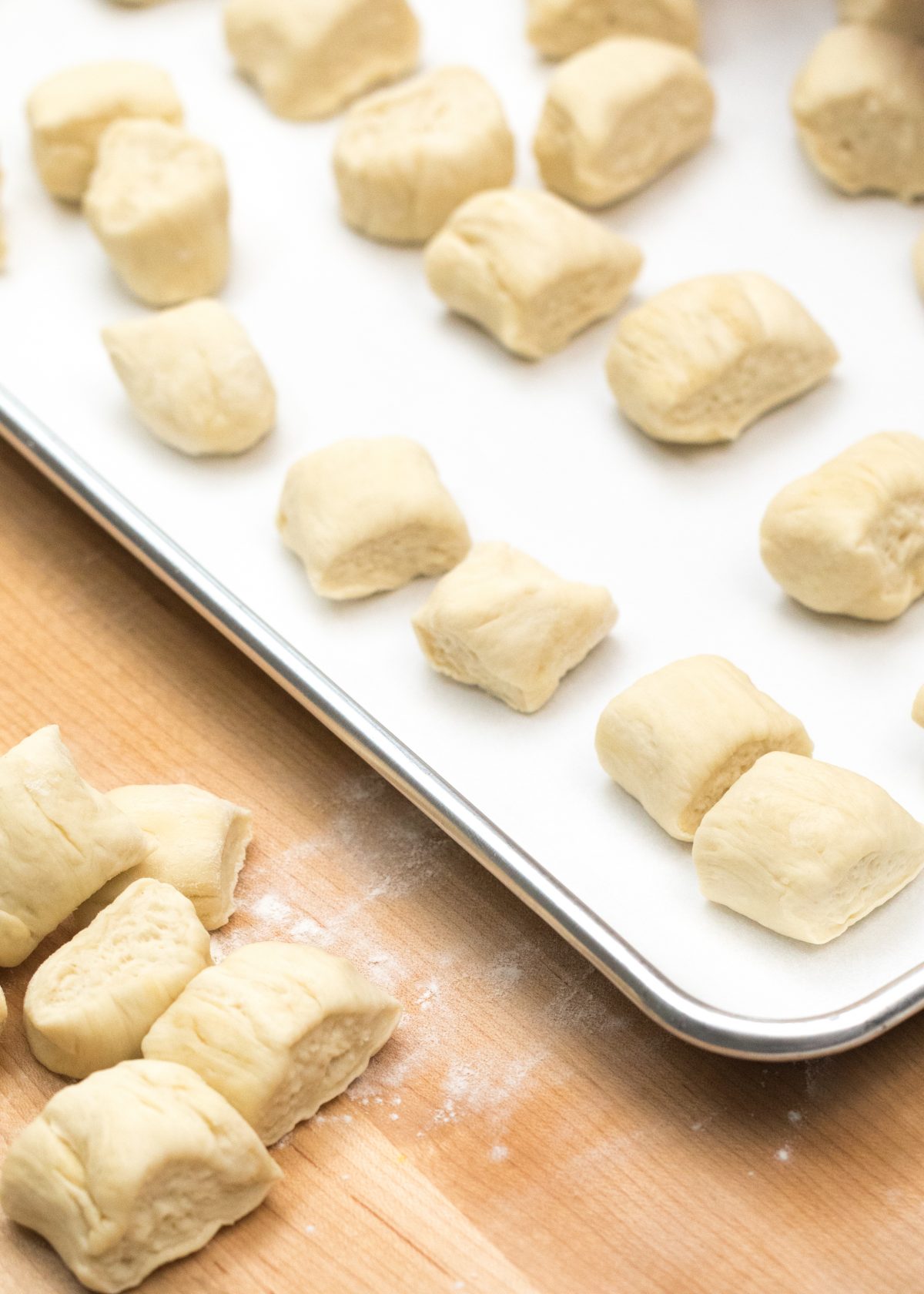Place bite size dough pieces onto baking sheet