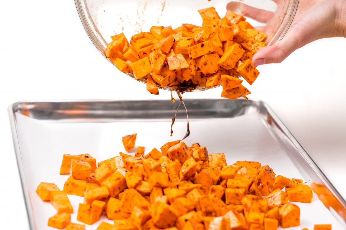 Transfer Roasted maple cinnamon sweet potatoes to baking sheet