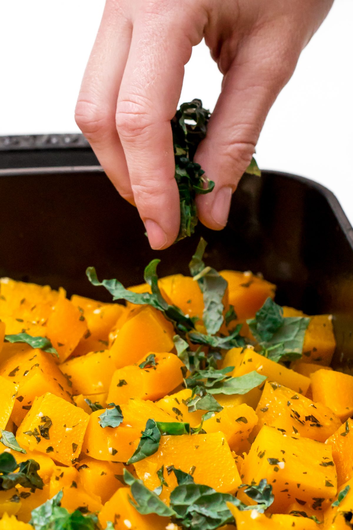 Add chopped kale to Roasted butternut squash with almond-pecan parmesan