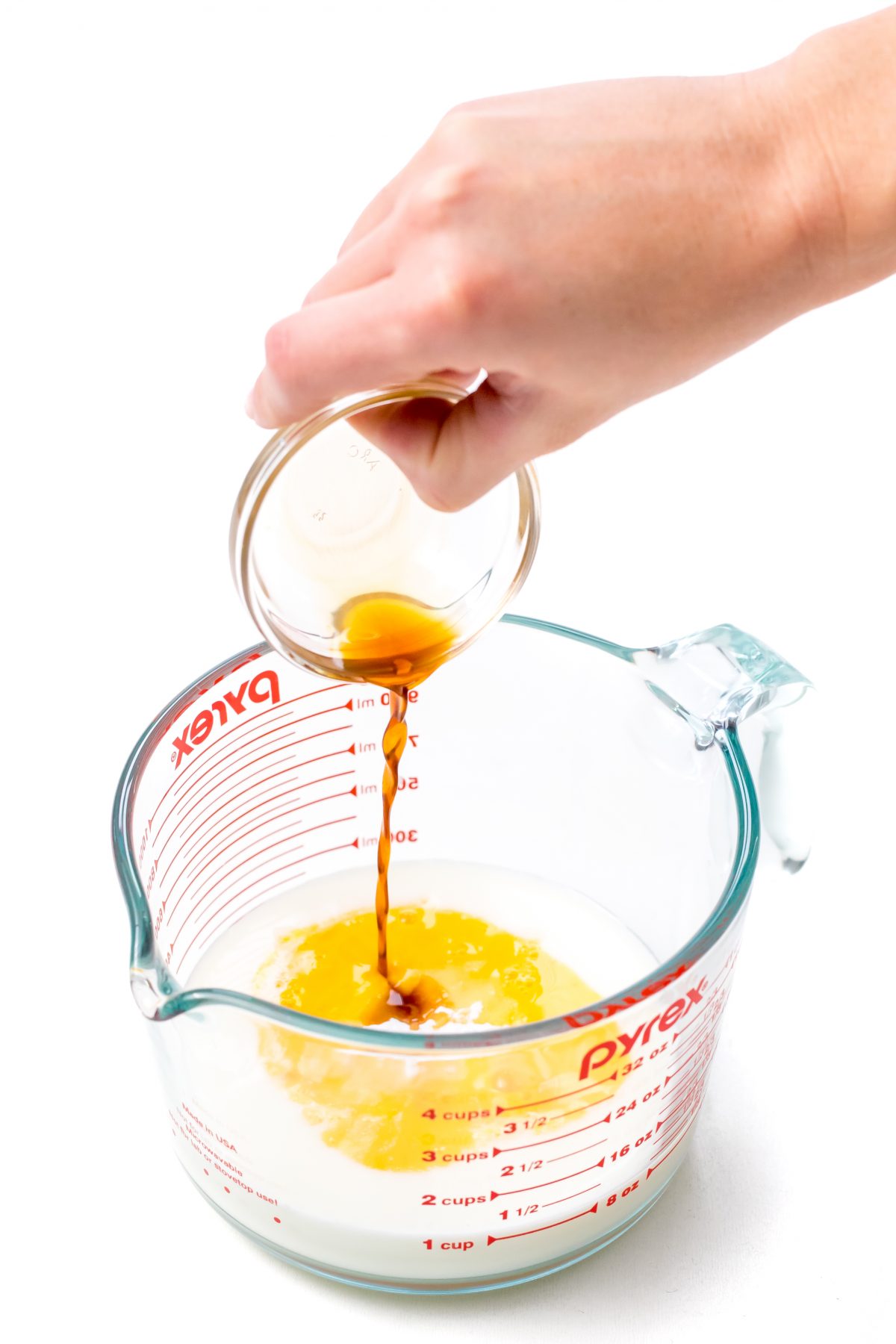 Add vanilla to buttermilk combination in liquid measuring cup