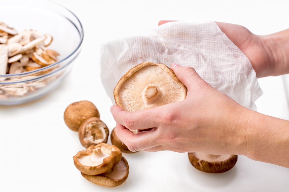 Wipe mushrooms with damp paper towel.