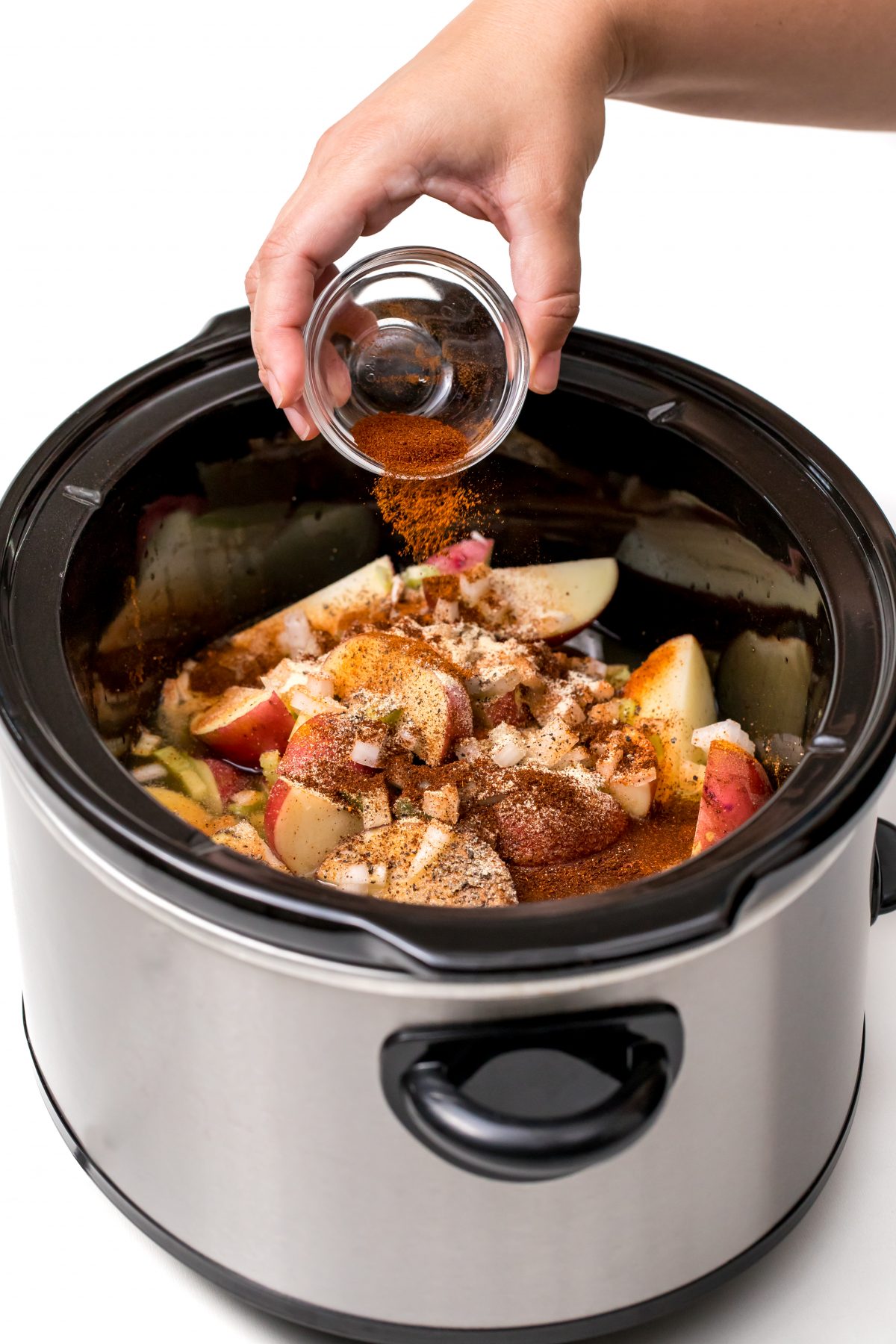 Place potatoes and spices in slow-cooker