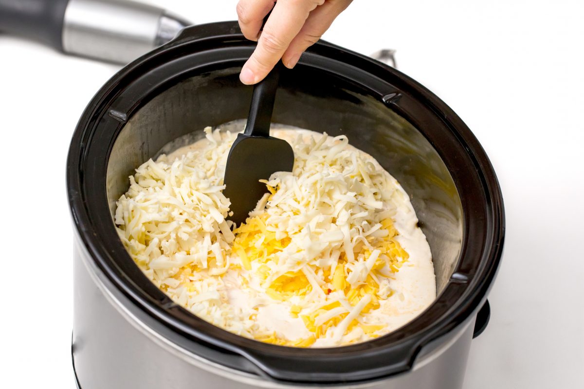 Stir ingredients together for Slow-cooker roasted garlic baked potato soup