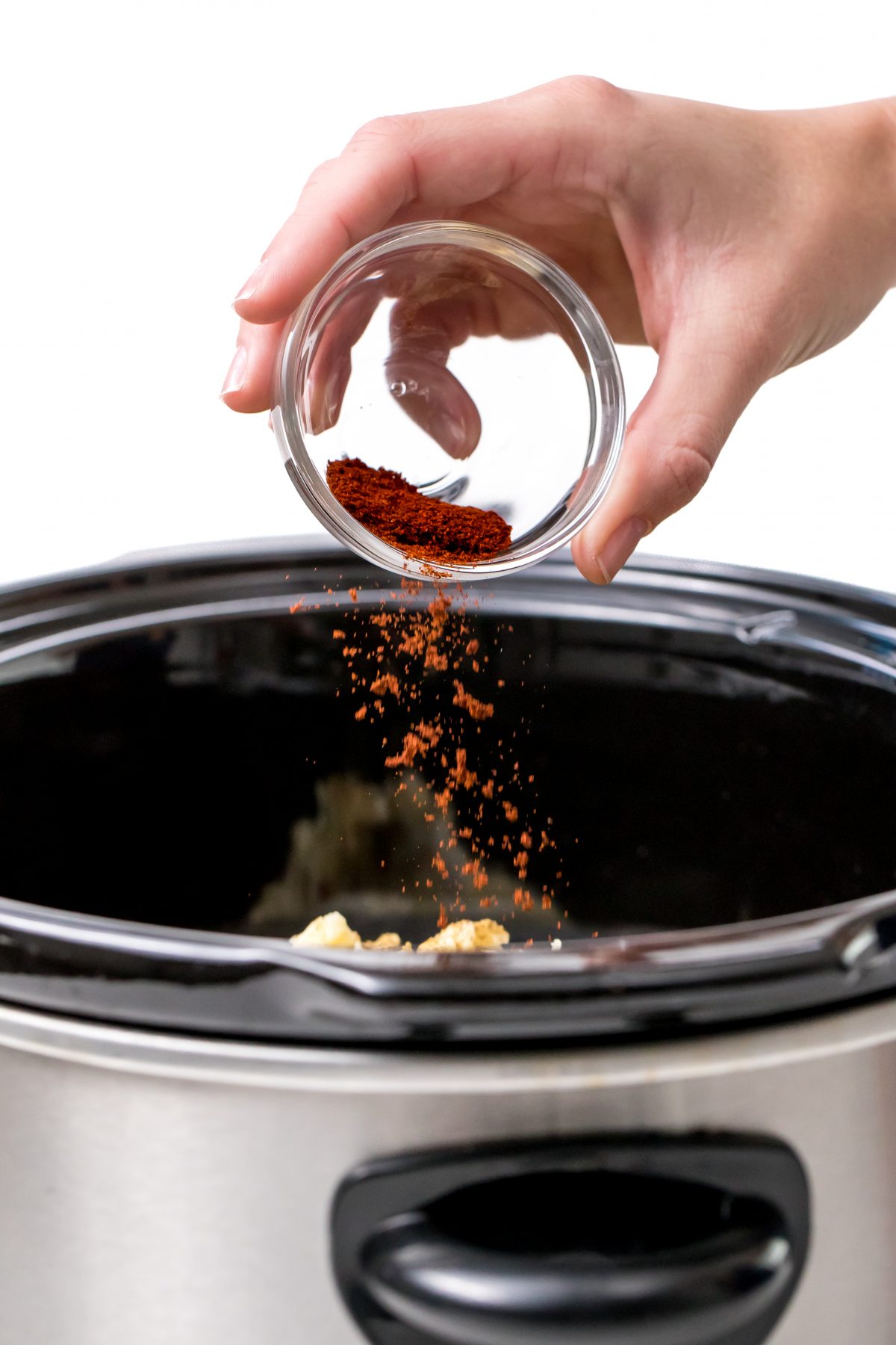 Add chili powder to slow-cooker