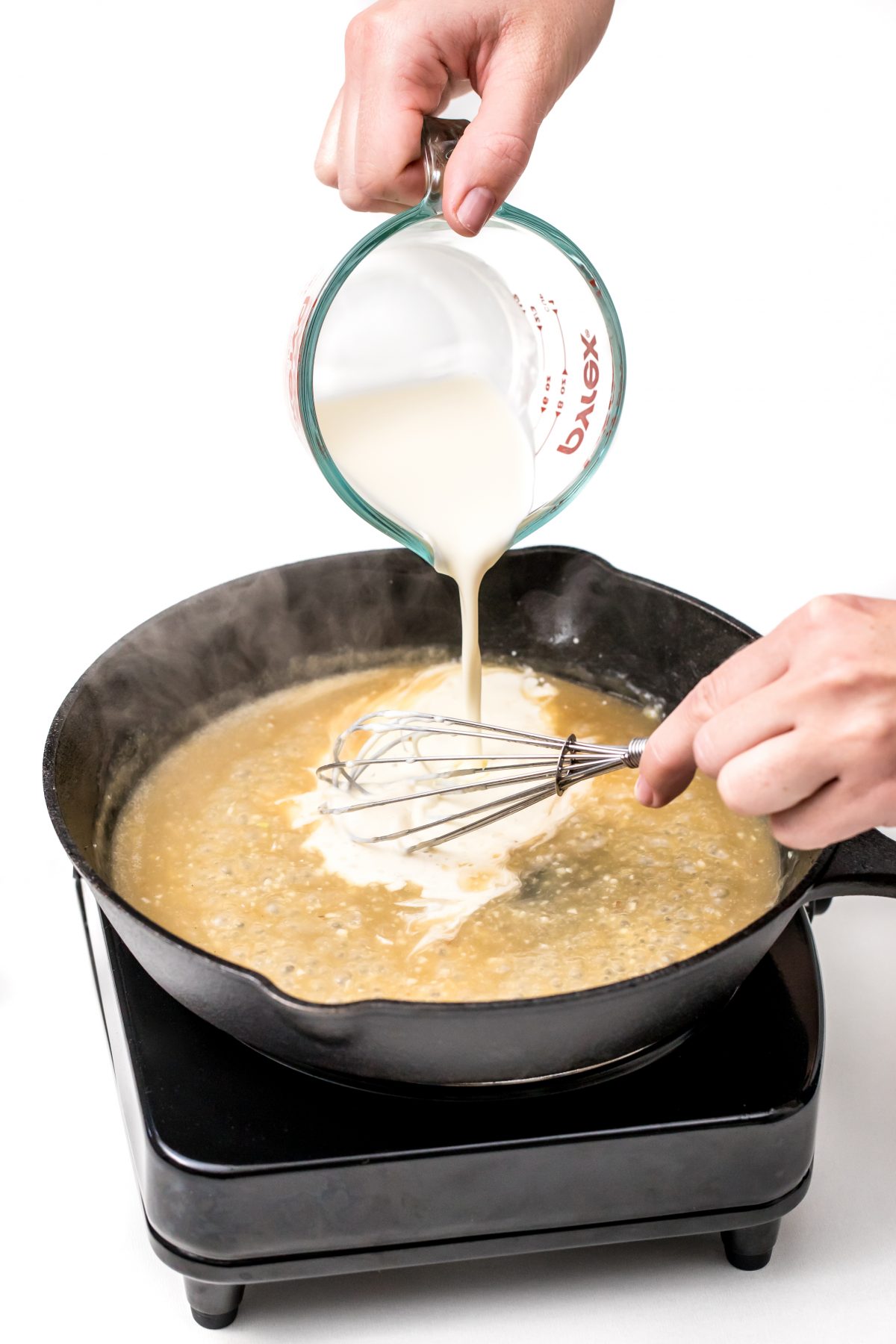 Pour in heavy cream and whisk