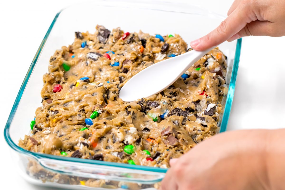 Spread cookie dough into glass pan