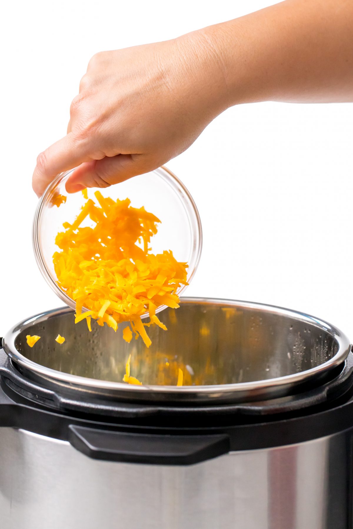 Shredded cheddar cheese added to Instant Pot