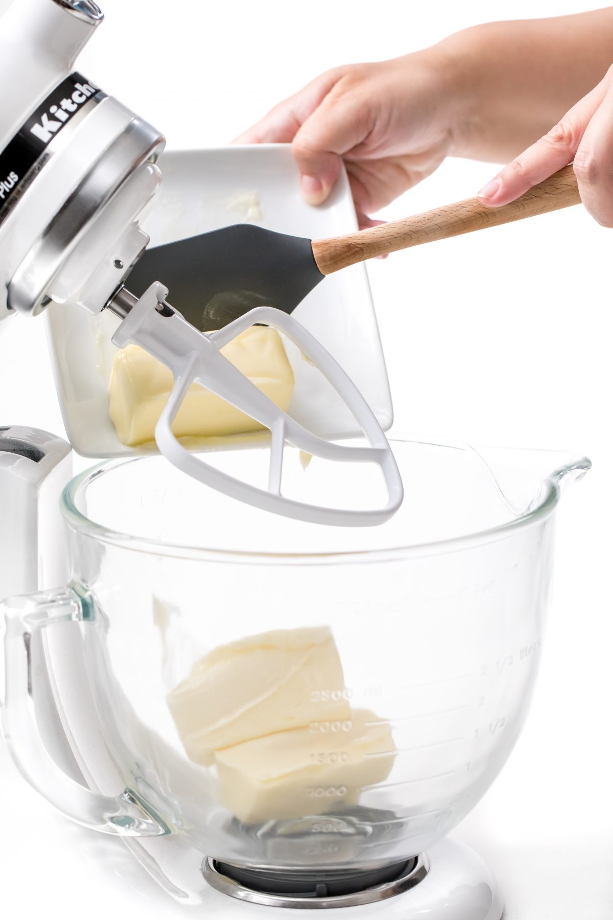 Begin buttercream frosting by adding room tempurature butter to mixer