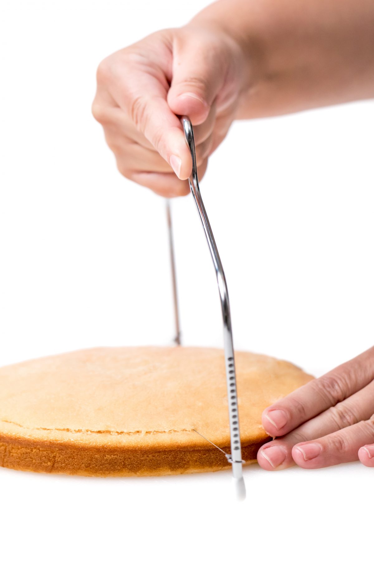Slice thick layer off top of each cake layer to create flat surface