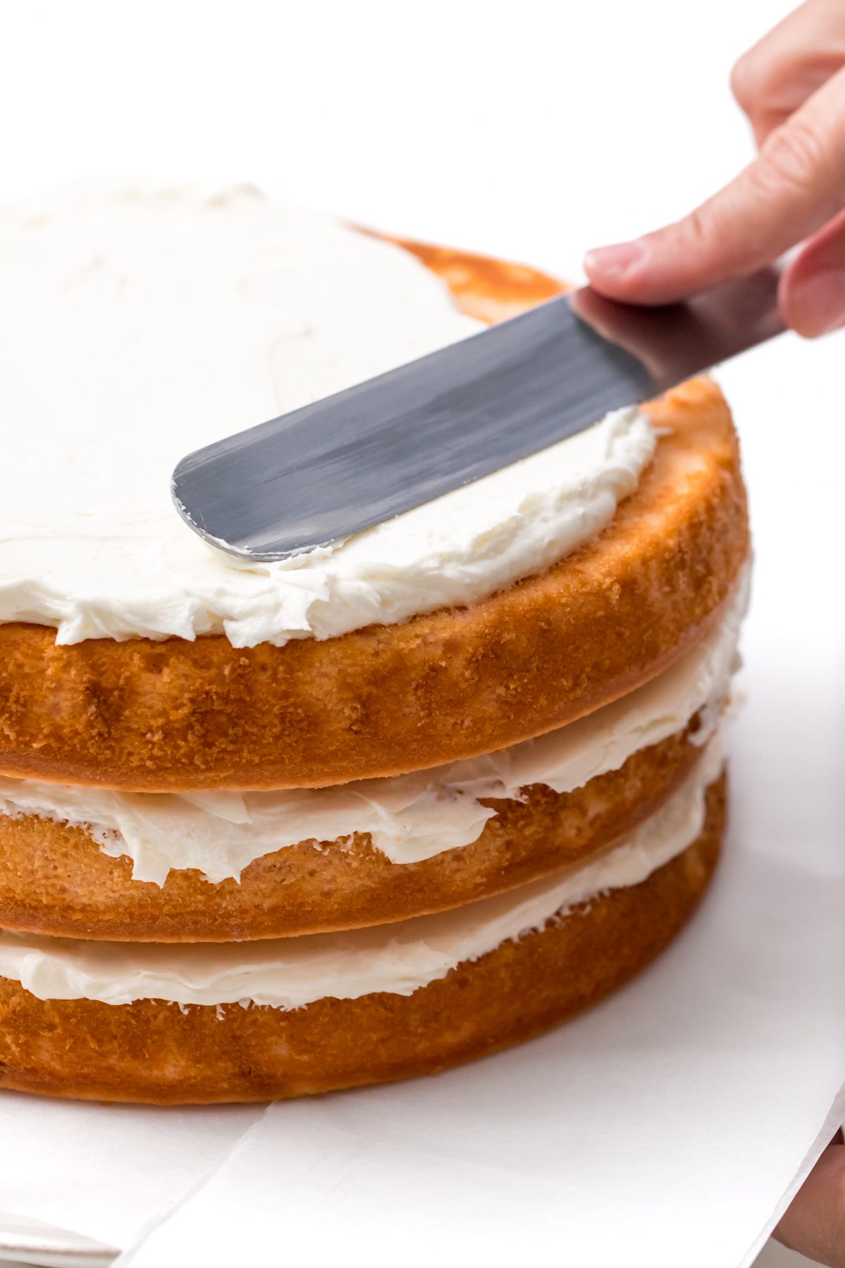 Spread frosting evenly on final cake layer