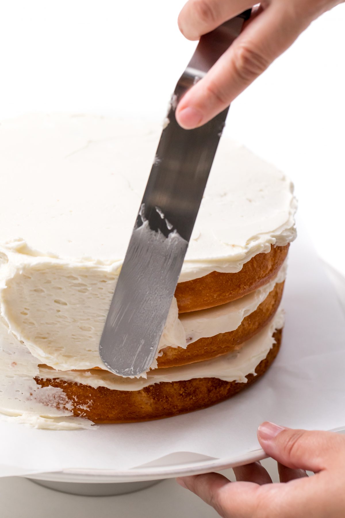 Apply buttercream frosting to sides of cake