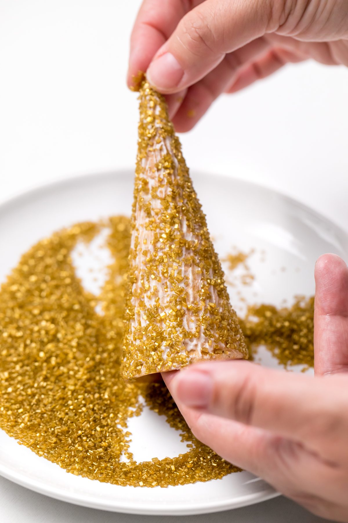 Make sure entire cone is covered thoroughly with sparkly sugar