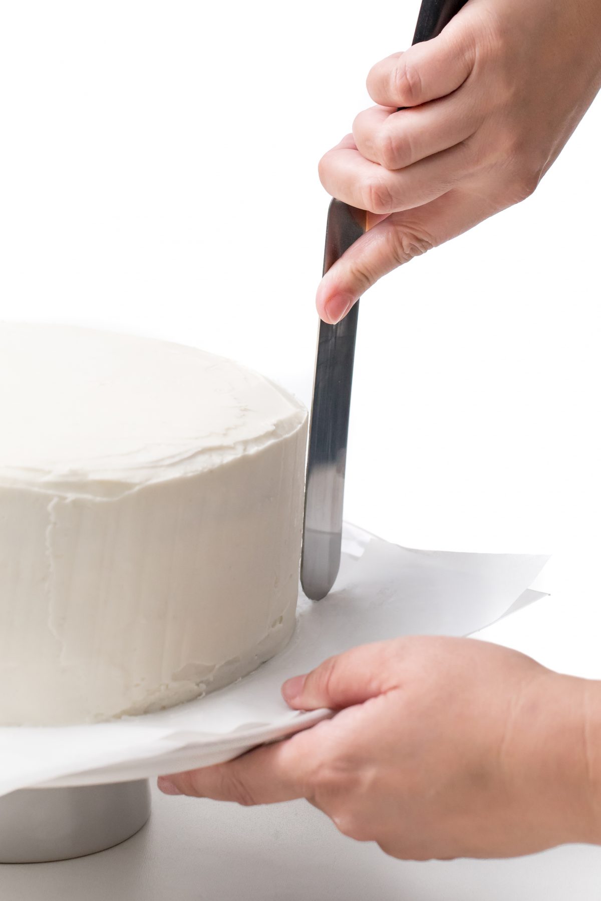 Smooth out buttercream on all surfaces of cake