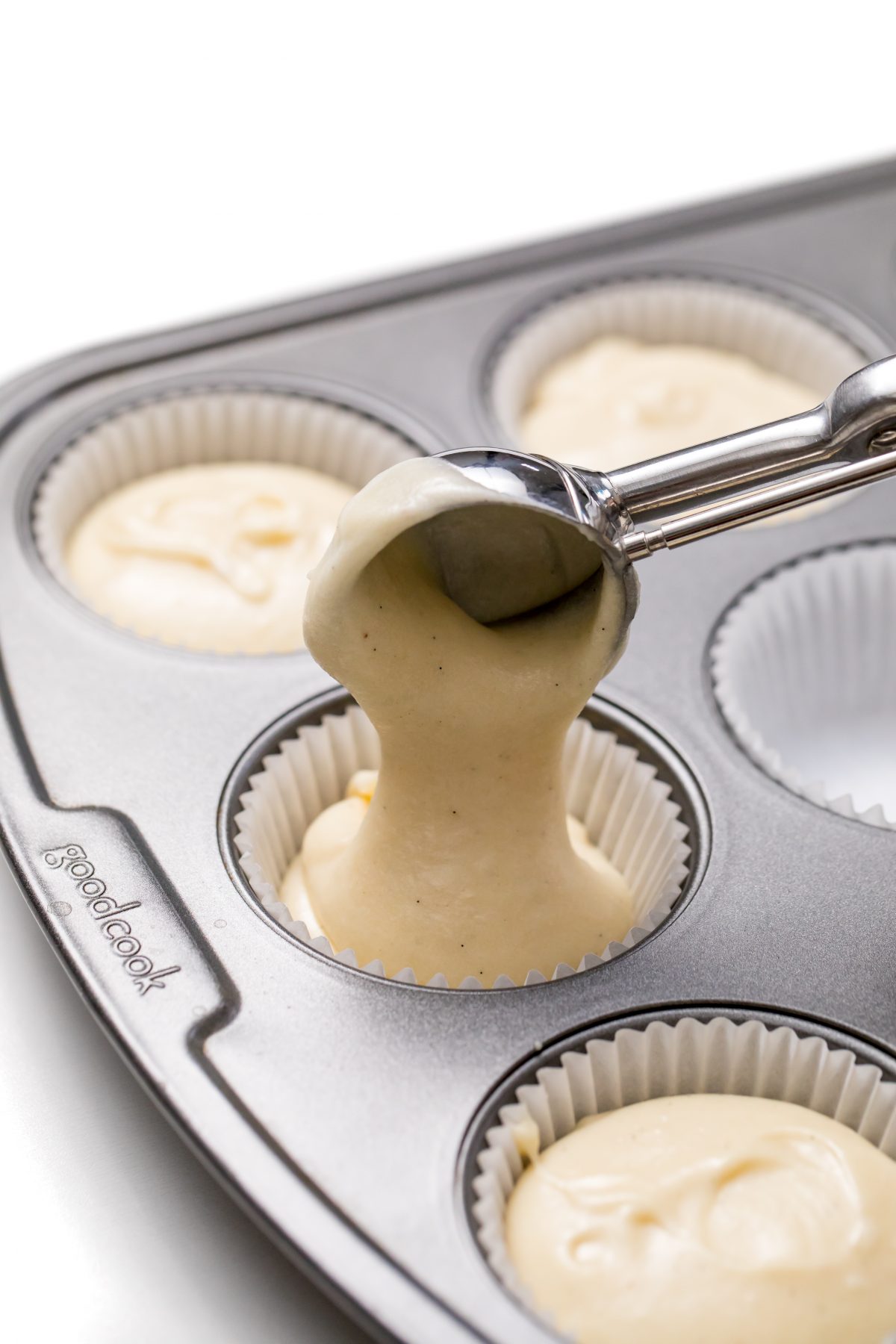 Scoop equal amounts of batter into lined cupcake pan to bake