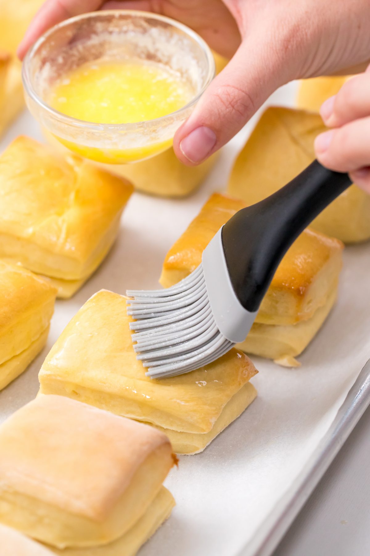 Brush the baked rolls with butter