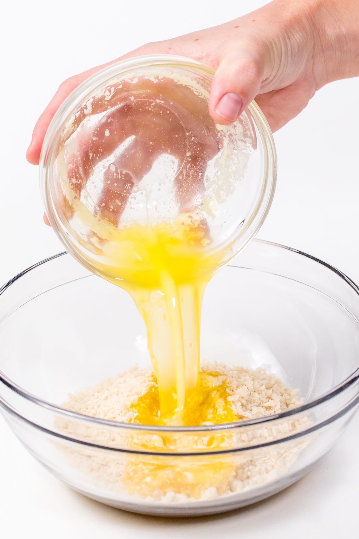 Pour melted butter over bread crumbs
