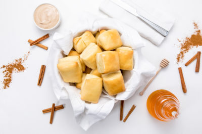 Basket of copycat texas roadhouse rolls and butter