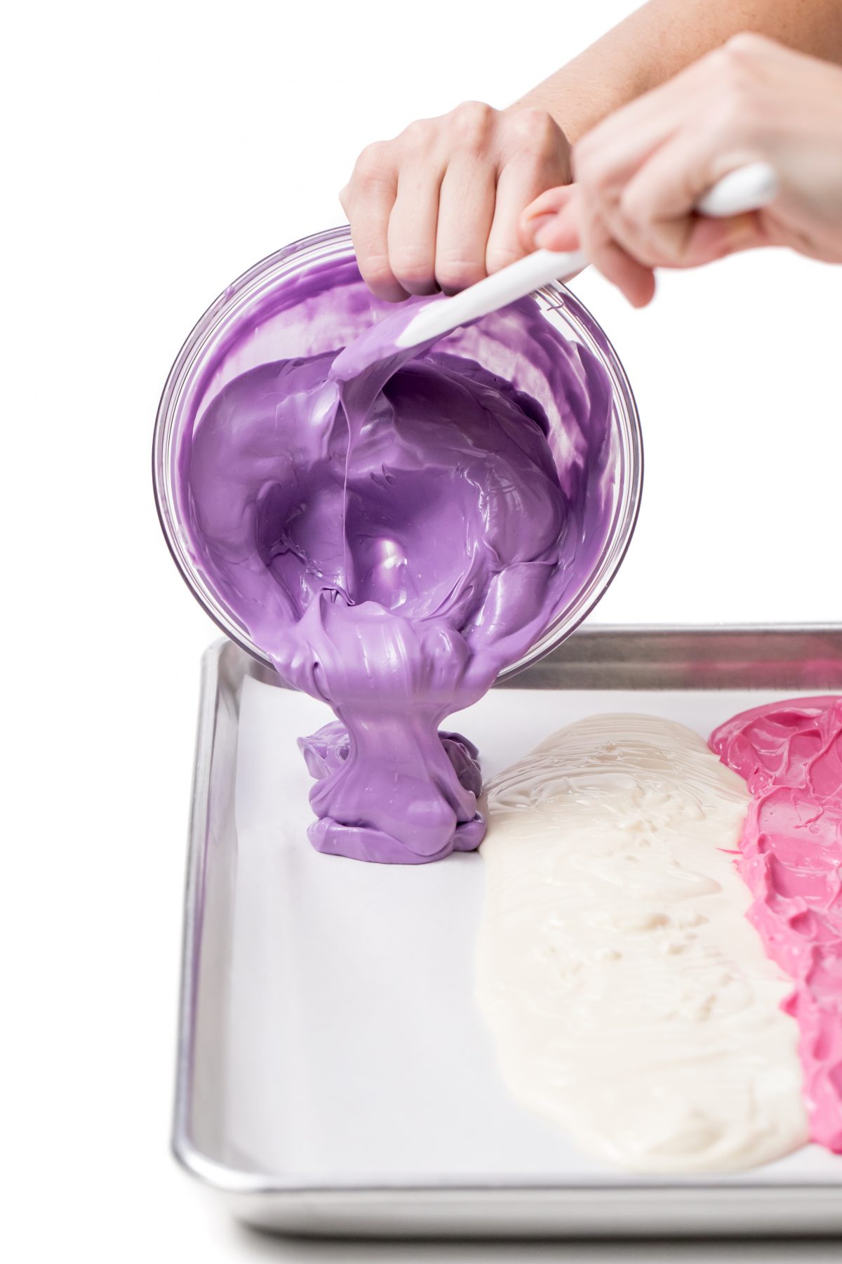 Finish pouring purple melted candy onto pan