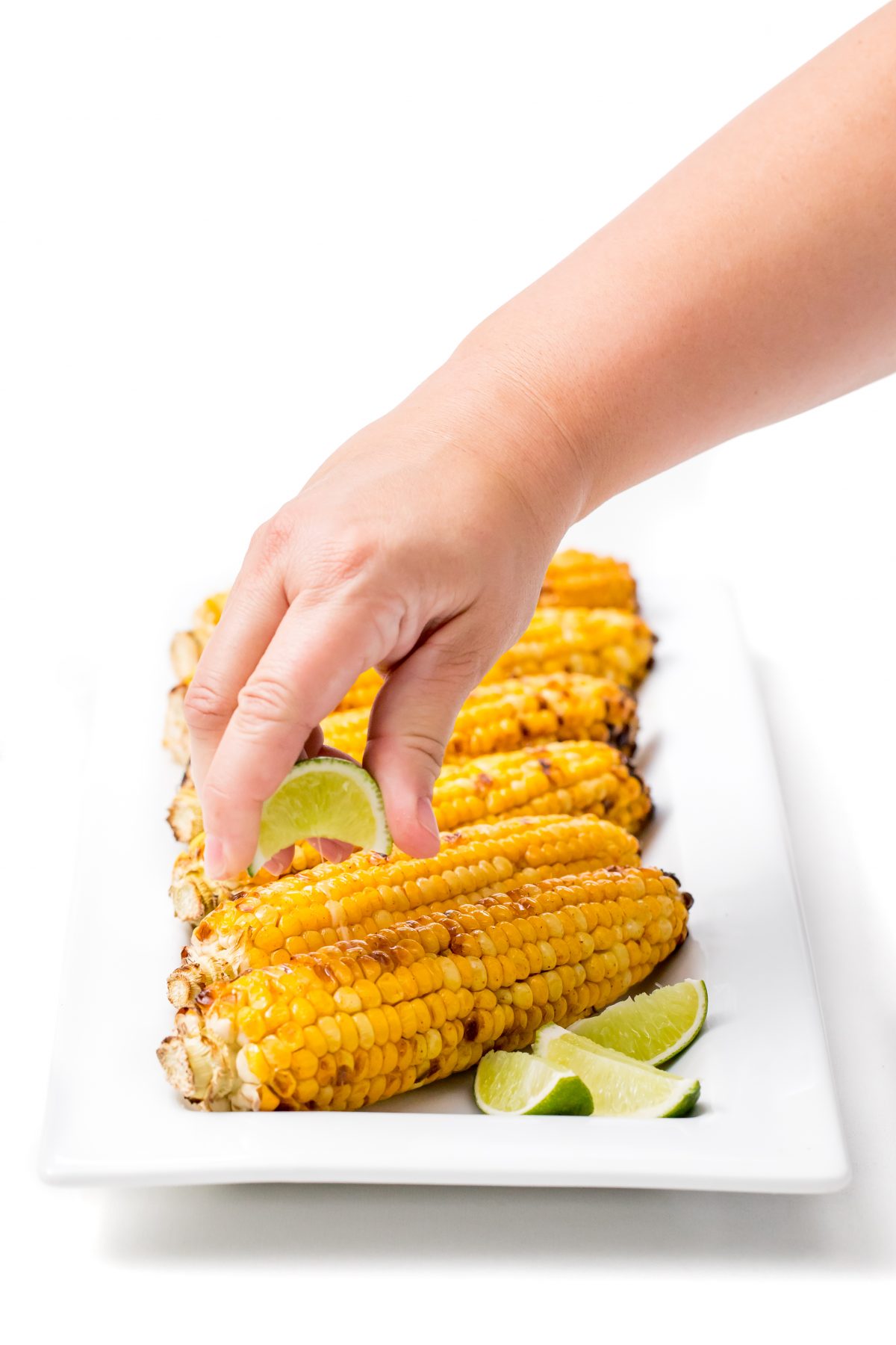 Squeeze fresh lime over corn