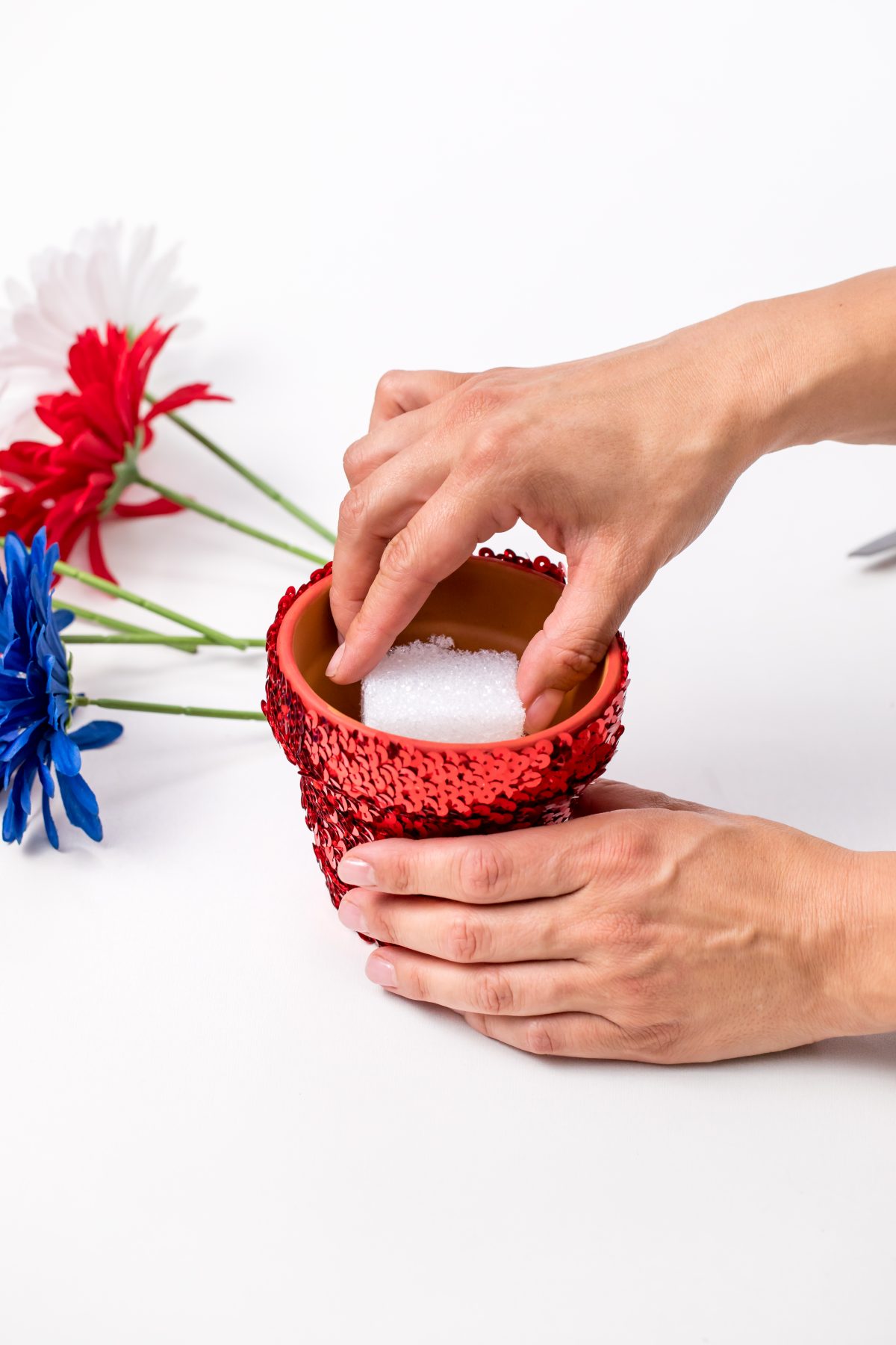 Place styrofoam inside of flower pot