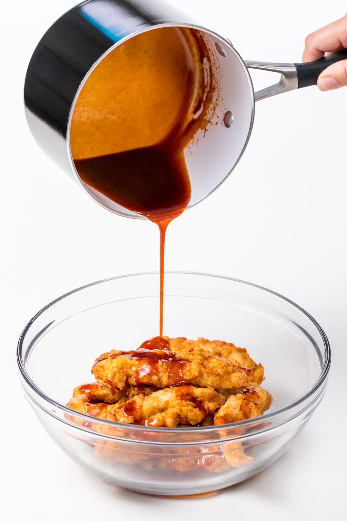 Pour honey chipotle sauce on cooked chicken