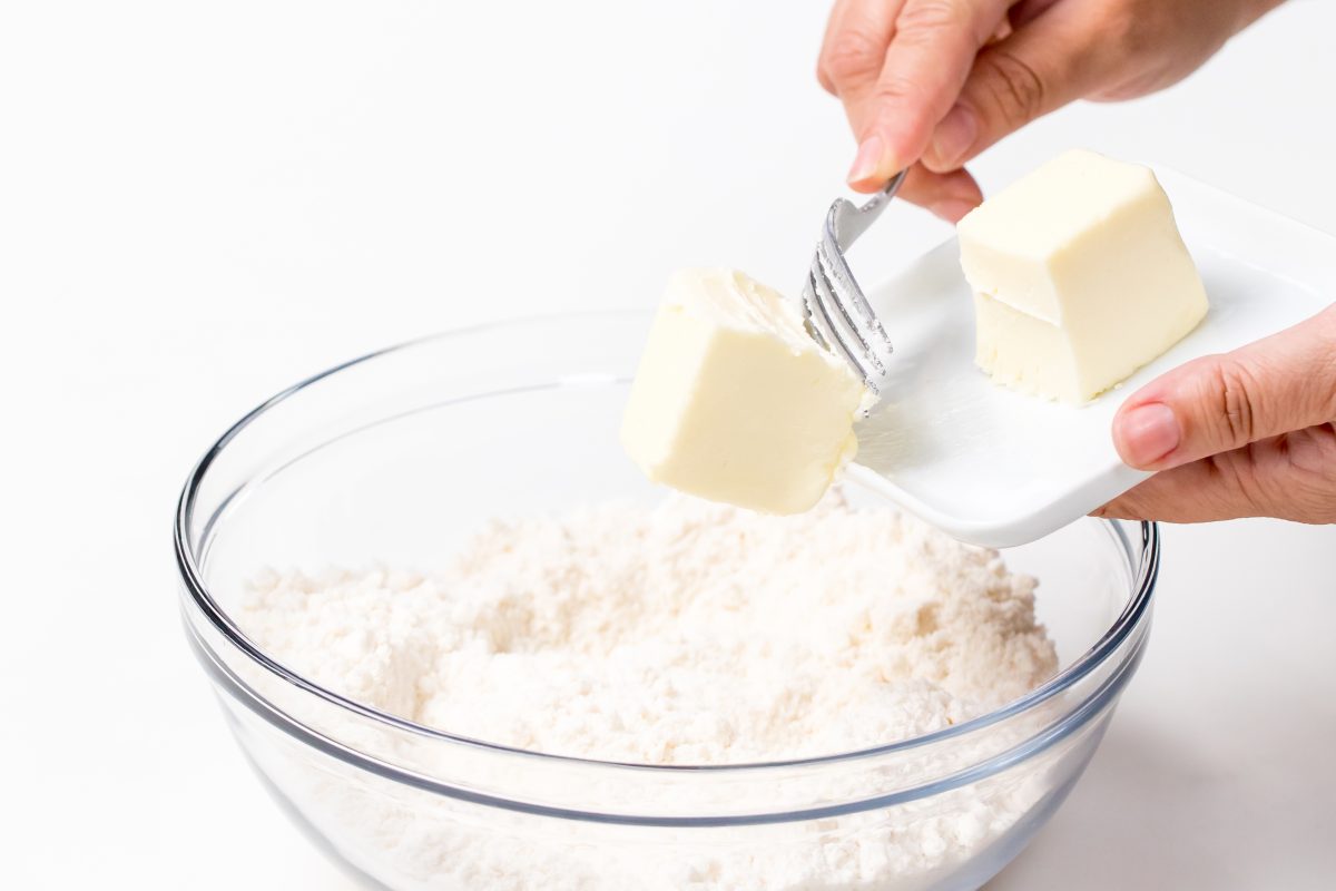 Add butter to flour and cake mix