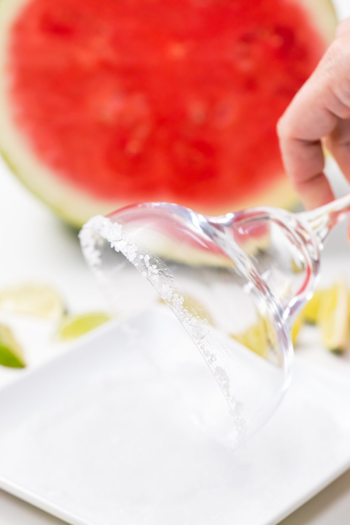 Dip rim of glass into salt for Best watermelon margaritas with just three ingredients