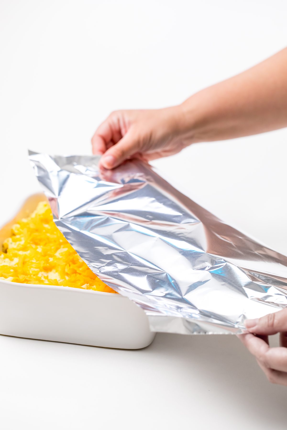 Cover the potatoes with foil to prevent the cheese from burning.
