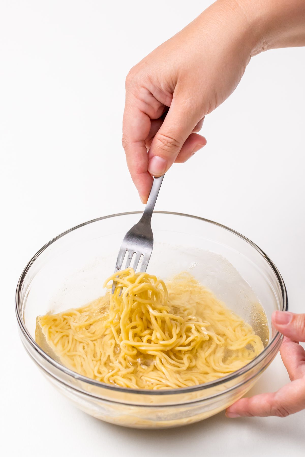 Stir around noodles and water