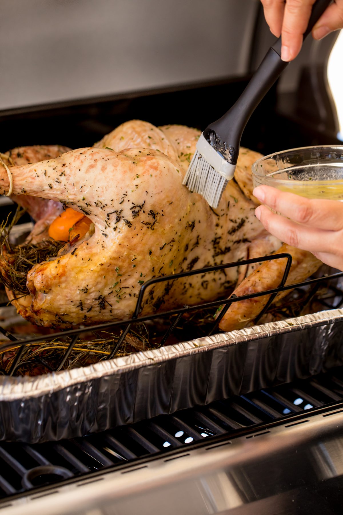 Occasionally baste the turkey with melted butter.