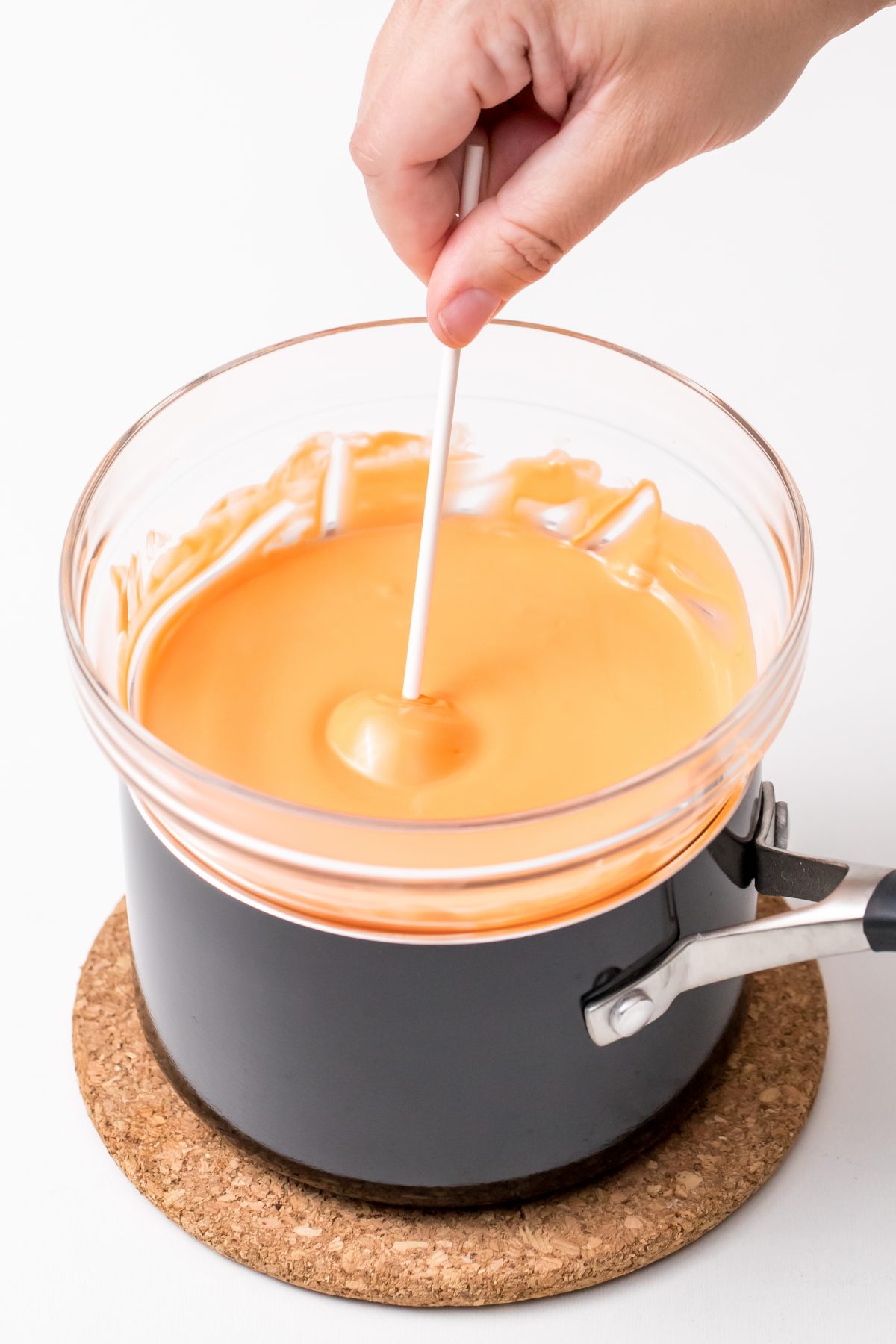 Dip each Monster cake-pop into melted orange Candy Melts