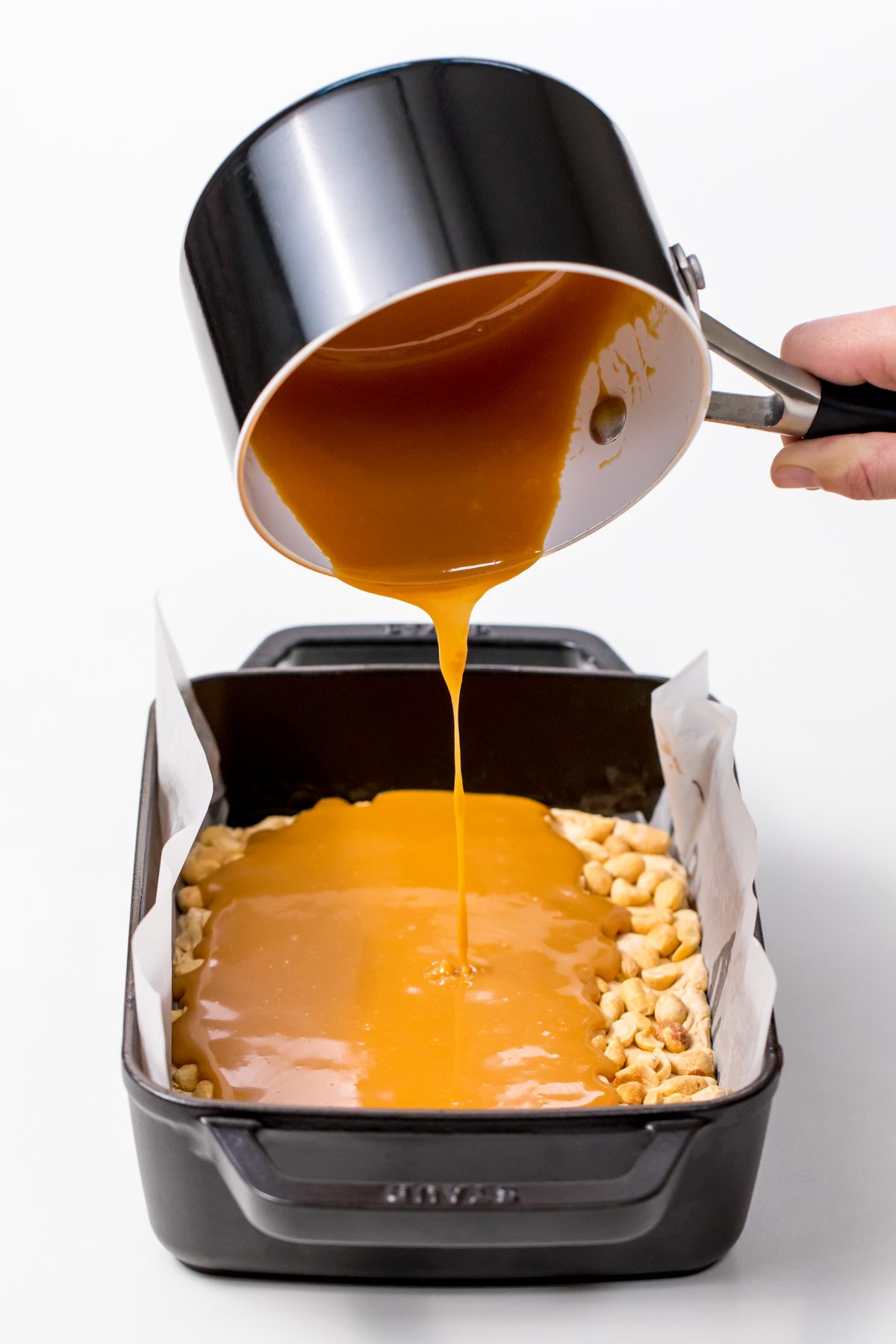 Pour melted caramel mixture into the baking dish