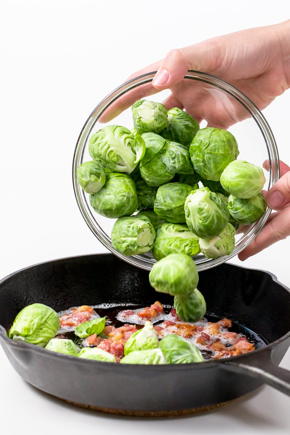 Add 1 pound of brussels sprouts to cooked bacon