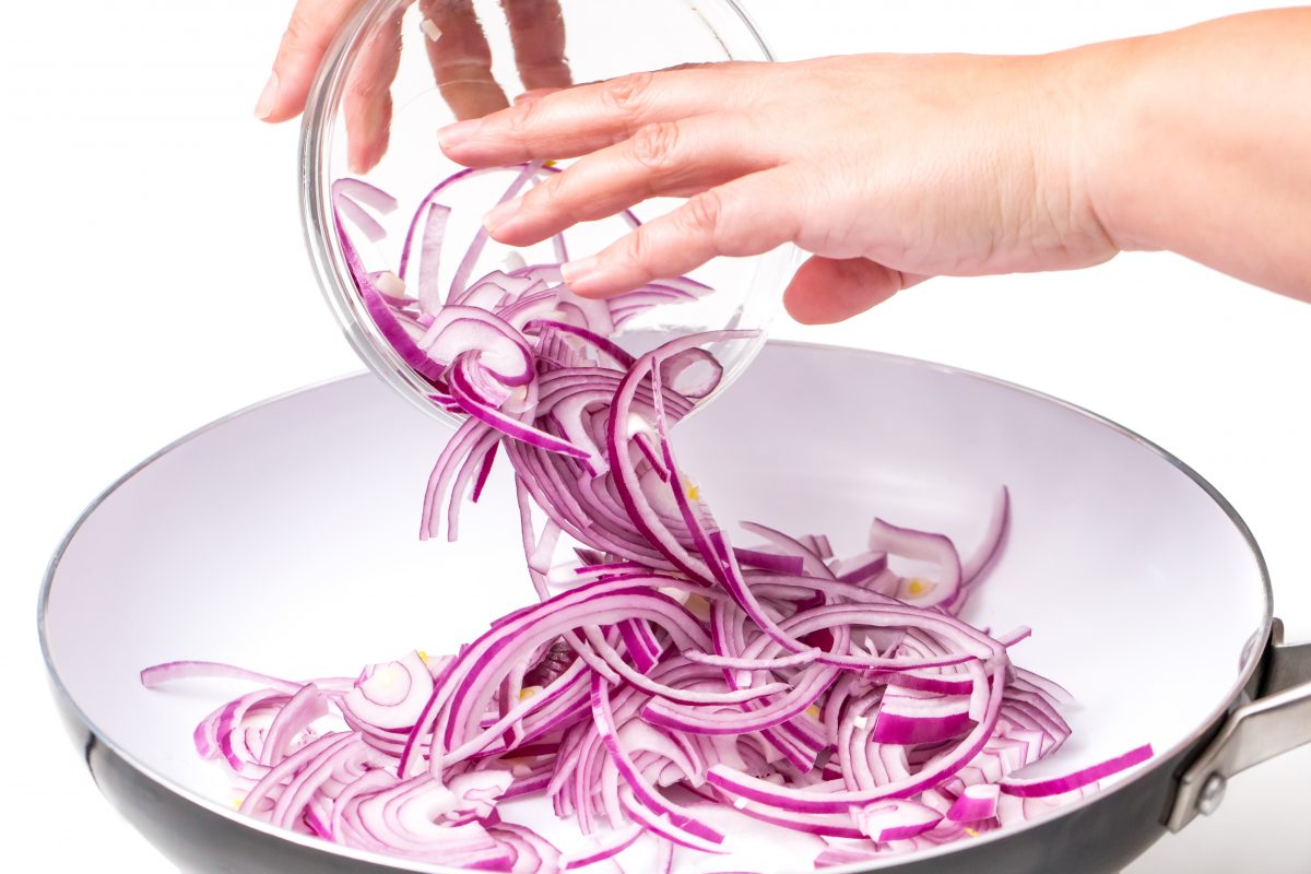 Add chopped red onions to hot canola oil and cook until translucent, but not caramelized.