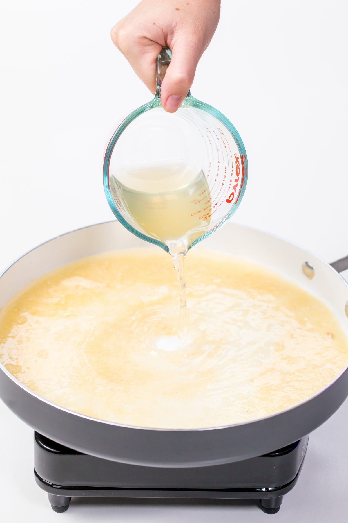 Pour chicken broth into rice flour