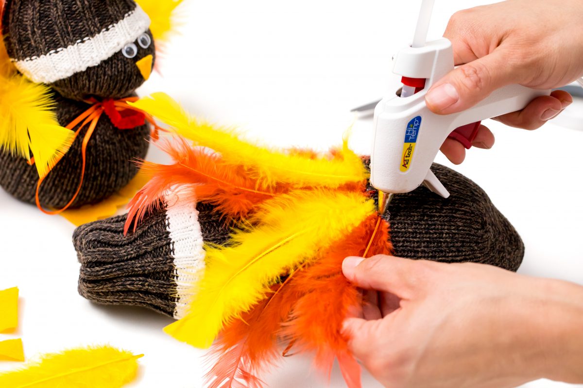 Attach feathers for Sock turkey craft